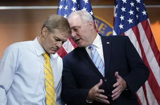FILE—Rep. Jim Jordan, R-Ohio, left, and Rep. Steve Scalise, R-La., confer during a news conference at the Capitol in Washington, Wednesday, June 8, 2022. The two GOP leaders have emerged as contenders to replace former House Speaker Kevin McCarthy who was voted out of the job by a contingent of hard-right conservatives. Jordan is now chairman of the House Judiciary Committee and a staunch ally of former President Donald Trump. House Majority Leader Steve Scalise, R-La., has long sought the top