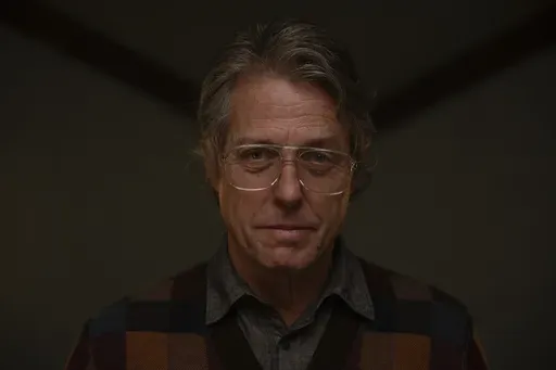 This image released by A24 shows Hugh Grant in a scene from "Heretic." (Kimberley French/A24 via AP)