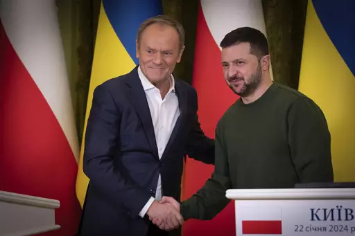 Poland's Prime Minister Donald Tusk, left, and Ukrainian President Volodymyr Zelenskyy shake hands during their meeting in Kyiv, Ukraine, Monday, Jan. 22, 2024. (Ukrainian Presidential Press Office via AP)