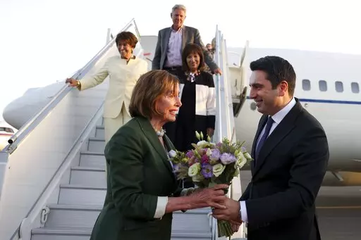 CORRECTS CREDIT - In this handout photo released by Armenian National Assembly via Photolure photo agency, Head of Armenian National Assembly Alen Simonyan, right, welcomes U.S. House of Representatives Nancy Pelosi upon her arrival at the International Airport outside of Yerevan, Armenia, Saturday, Sept. 17, 2022. A US Congressional delegation headed by Speaker of the House Nancy Pelosi arrived Saturday in Armenian, where a cease-fire has held for three days after an outburst of fighting with n