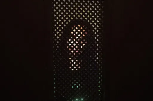 An experimental art installation with an AI Jesus entitled, Deus in Machina, installed in a confessional in St. Peter's Chapel in the old town of Lucerne, Switzerland, Sunday, Aug. 25, 2024. (Urs Flueeler/Keystone via AP)