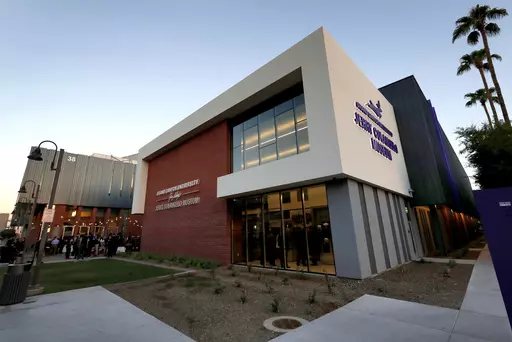The Jerry Colangelo Museum at Grand Canyon University is seen at at dusk in Phoenix, on Sept. 20, 2017. Grand Canyon University, the country's largest Christian university, is being fined $37.7 million by the federal government amid accusations that it misled students about the cost of its graduate programs. (AP Photo/Matt York, File)