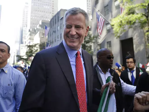 New York City Mayor Bill de Blasio winks at someone during the Columbus Day Parade in New York, Monday, Oct. 12, 2015. The former New York City Mayor says he will run for Congress in a redrawn district that includes his Brooklyn home. De Blasio announced Friday, May 20, 2022 on MSNBC’s “Morning Joe” that he will seek the Democratic nomination for the 10th Congressional District.   (AP Photo/Seth Wenig, File)