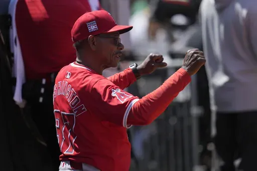 Los Angeles Angels manager Ron Washington gestures toward players during the seventh inning of a baseball game against the Oakland Athletics in Oakland, Calif., Saturday, July 20, 2024. (AP Photo/Jeff Chiu)