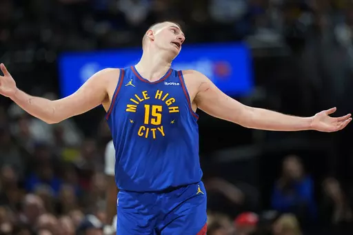 Denver Nuggets center Nikola Jokic calls for a foul call after he scored a basket against the New Orleans Pelicans during the second half of an NBA basketball game Friday, Jan. 12, 2024, in Denver. (AP Photo/David Zalubowski)