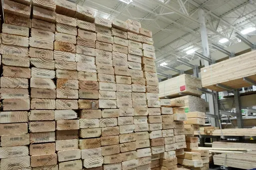 Stacks of lumber are set up on shelves at a local Lowes store Tuesday, April 1, 2025, in Tempe, Ariz. (AP Photo/Ross D. Franklin)