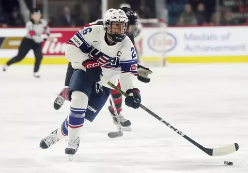 United States' Kendall Coyne Schofield skates with the puck against Canada during the first period of a Rivalry Series hockey game Nov. 17, 2022, in Kamloops, British Columbia. Coyne Schofield, a three-time Olympian and former U.S. captain, will suit up for Minnesota’s Professional Women's Hockey League opener at Boston on Jan. 3. The game will underline Coyne Schofield’s determination in returning to competitive play, after the birth of her son, now 6 months old. (Jesse Johnston/The Canadia