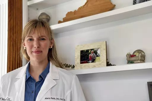 OB/GYN Dr. Alecia Fields stands for a portrait in her home in rural Kentucky on Saturday, June 10, 2023. Fields, who has been an advocate for reproductive rights, said the overturning of Roe v. Wade leak brought up “a lot of fears” and made her wonder: “What is this going to mean on the ground? Am I going to be criminalized?” (AP Photo/Timothy D. Easley)