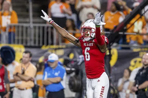 North Carolina State cornerback Corey Coley (6) celebrates during the first half of an NCAA college football game against Tennessee, Saturday, Sept. 7, 2024, in Charlotte, N.C. (AP Photo/Scott Kinser)