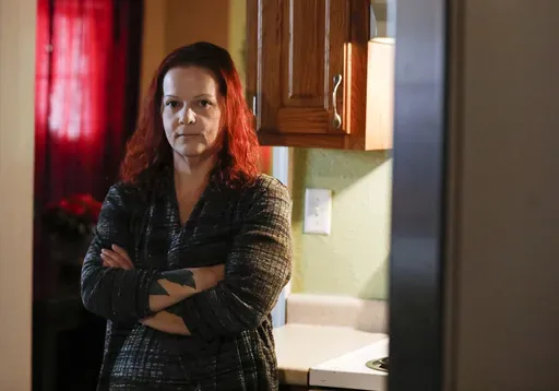 Mylissa Farmer stands for a portrait at her home in Joplin, Mo., on Sept. 28, 2022. (Nathan Papes/The Springfield News-Leader via AP, File)