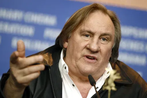 Actor Gerard Depardieu addresses the media during the press conference for the film 'Saint Amour' at the 2016 Berlinale Film Festival in Berlin, Germany, on Feb. 19, 2016. (AP Photo/Axel Schmidt, File)