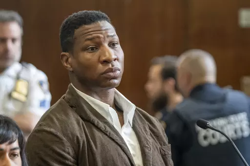 Jonathan Majors is seen in court during a hearing in his domestic violence case, Tuesday, June 20, 2023 in New York. Majors’ domestic violence case will go to trial Aug. 3, the judge said Tuesday, casting him in a real-life courtroom drama as his idled Hollywood career hangs in the balance. (AP Photo/Steven Hirsch, Pool)