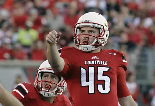 Louisville place kicker John Wallace (45) watches as his second of three field goal attempts goes through the uprights in a 20-10 win over Wake Forest in a NCAA college football game in Louisville, Ky., Saturday, Sept. 27, 2014. Former Louisville place kicker John Wallace, whose school-record 66 career field goals included two in a 2013 Sugar Bowl upset of Florida, has died, Wednesday, May 15, 2024. He was 31.(AP Photo/Garry Jones, File)