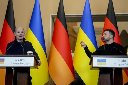 Ukraine's President Volodymyr Zelenskyy, right, and German Chancellor Olaf Scholz attend a press conference in Kyiv, Ukraine, Monday, Dec.2, 2024. (AP Photo/Evgeniy Maloletka)