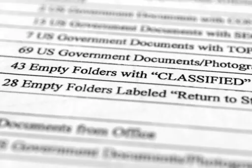 A page from a FBI property list of items seized from former President Donald Trump's Mar-a-Lago estate and made public by the Department of Justice, are photographed Friday, Sept. 2, 2022. FBI agents who searched the home found empty folders marked with classified banners. The inventory reveals in general terms the contents of the 33 boxes taken during the Aug. 8 search. (AP Photo/Jon Elswick)