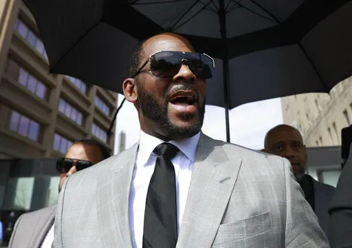 Musician R. Kelly leaves the Leighton Criminal Court building in Chicago on June 6, 2019. Kelly’s federal trial starts Monday in Chicago. (AP Photo/Amr Alfiky, File)