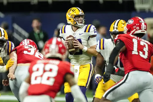 LSU quarterback Garrett Nussmeier (13) drops back to pass in the second half of the Southeastern Conference Championship football game against Georgia Saturday, Dec. 3, 2022 in Atlanta. (AP Photo/John Bazemore)