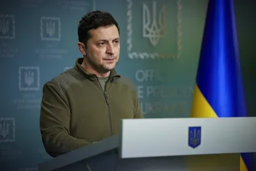 In this photo provided by the Ukrainian Presidential Press Office, Ukrainian President Volodymyr Zelenskyy delivers his speech addressing the nation in Kyiv, Ukraine, Friday, Feb. 25, 2022. Russian troops bore down on Ukraine's capital Friday, with explosions and gunfire sounding in the city as the invasion of a democratic country fueled fears of wider war in Europe and triggered new international efforts — including direct sanctions on President Vladimir Putin — to make Moscow stop. (Ukrain