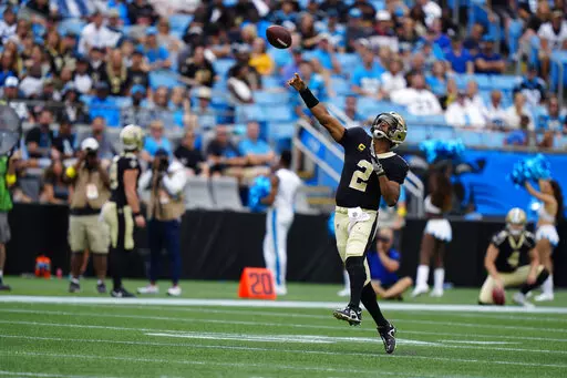 New Orleans Saints quarterback Jameis Winston (2) throws a touchdown pass during the second half of an NFL football game against the Carolina Panthers, Sunday, Sept. 25, 2022, in Charlotte, N.C. (AP Photo/Jacob Kupferman)