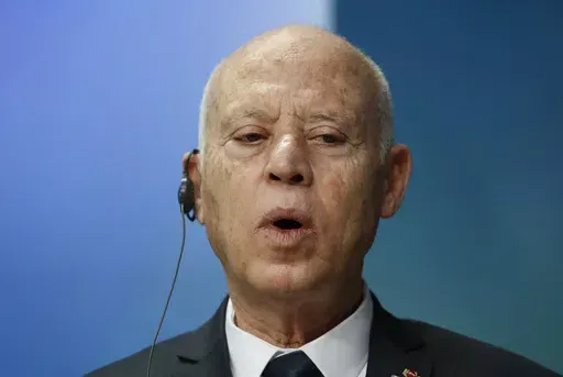 Tunisia's President Kais Saied speaks during a media conference at an EU Africa summit in Brussels, Friday, Feb. 18, 2022. Two Tunisian journalists are kept in pre-trial detention as authorities continued a wave of arrests targeting perceived critics of President Kais Saied's government. Borhen Bsaies and Mourad Zeghidi remain behind bars after being apprehended. They were accused of violating a cybercrime law against fake news. (Johanna Geron, Pool Photo via AP, File)
