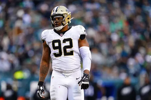 New Orleans Saints defensive end Marcus Davenport in waits for a play during the team's NFL football game against the Philadelphia Eagles on Nov. 21, 2021, in Philadelphia. Davenport is recuperating from right shoulder surgery last January and multiple offseason surgeries on his pinky, which ultimately resulted in most of its removal. Davenport said he does not expect the amputation to adversely affect his pass rush. (AP Photo/Matt Rourke, File)