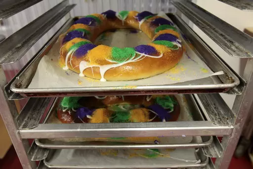 Mardi Gras King Cakes by pastry chef Jean-Luc Albin at Maurice French Pastries are displayed on Feb. 10, 2011, in Metairie, La. A thief stole seven king cakes — about as many as he could carry — during a break-in last week at a New Orleans bakery. The thief also took cash and a case of vodka from Bittersweet Confections last Wednesday, Jan. 24, 2024 according to New Orleans Police Department. (AP Photo/Gerald Herbert, File