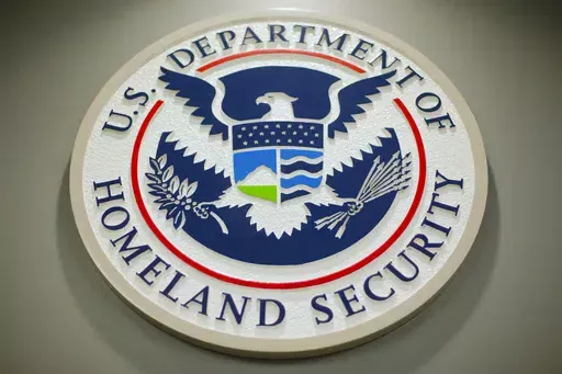 The Department of Homeland Security logo is seen during a news conference in Washington, Feb. 25, 2015. The Biden administration says it has sent about 50 Haitians back to their country, marking its first deportation flight in months to the Caribbean nation struggling under surging gang violence. Authorities didn’t offer details of flight, Thursday, April 18, 2024, beyond how many deported Haitians were aboard. The Homeland Security Department said it will continue to enforce U.S. laws and imm