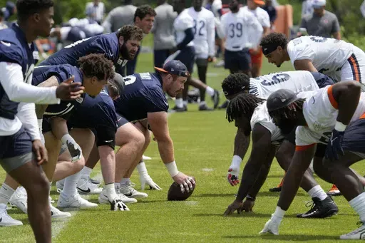 Chicago Bears players work on the field during NFL football practice at the team's minicamp in Lake Forest, Ill., Wednesday, June 5, 2024. (AP Photo/Nam Y. Huh, File)