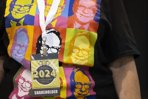 Shareholder Tina Schmidt of Cozad, Neb., wears a shirt with Warren Buffett's portrait in the style of an Andy Warhol painting at the Berkshire Hathaway annual meeting on May 4, 2024, in Omaha, Neb. (AP Photo/Rebecca S. Gratz, File)