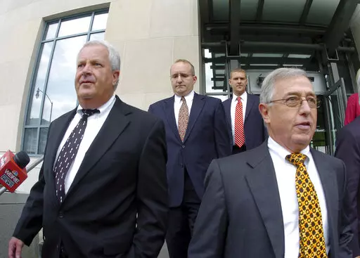 In this Tuesday, Sept., 15, 2009, file photo, former Luzerne County Court Judges Michael Conahan, front left, and Mark Ciavarella, front right, leave the United States District Courthouse in Scranton, Pa.  The two Pennsylvania judges who orchestrated a scheme to send children to for-profit jails in exchange for kickbacks were ordered to pay more than $200 million to hundreds of children who fell victim to their crimes.
U.S. District Judge Judge Christopher Conner awarded $106 million in compens