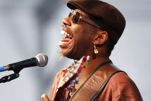 Blues guitarist and singer Walter 'Wolfman' Washington performs with the Joe Krown Trio at the Louisiana Jazz and Heritage Festival in New Orleans, on April 29, 2011. New Orleans music legend Walter “Wolfman” Washington, a cornerstone of the city's musical nightlife for decades, has died of cancer, just days after turning 79. Washington died on Dec. 22, 2022, at Passages Hospice, The Times-Picayune/The New Orleans Advocate reported. (AP Photo/Gerald Herbert, File)