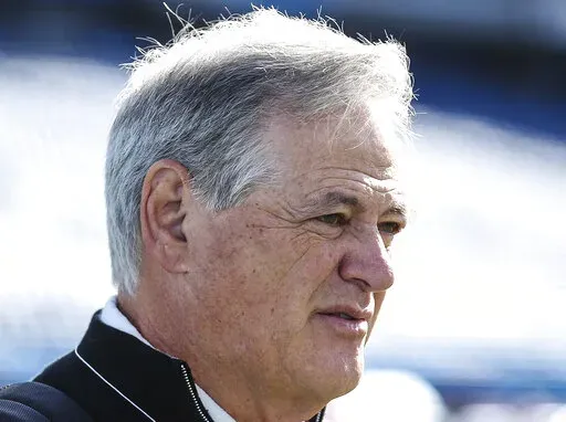 New Orleans Saints General Manager Mickey Loomis walks the sidelines during warm-ups before an NFL football game against the Titans in Nashville, Tenn., Sunday, Nov. 14, 2021. Even as Saints general manager Mickey Loomis spoke highly of defensive coordinator Dennis Allen on Friday, Jan. 28, 2022, as a candidate to replace retired coach Sean Payton, he also emphasized his desire to thoroughly consider candidates from outside the club. (AP Photo/Gary McCullough, File)