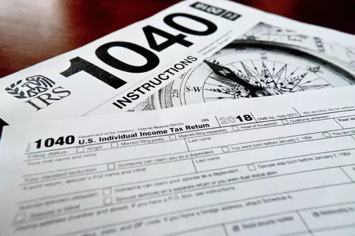FILE- Internal Revenue Service taxes forms are seen on Feb. 13, 2019. If you have unpaid or unfiled taxes, the start of a new tax season and the looming reminders of debt might fill you with dread. But it’s best to take care of back taxes sooner rather than later: The longer you put off the task, the more you’ll pay in interest and penalties. Even if you can’t pay in full, you can still take meaningful steps toward addressing the debt. To handle your overdue taxes, read any tax notices you