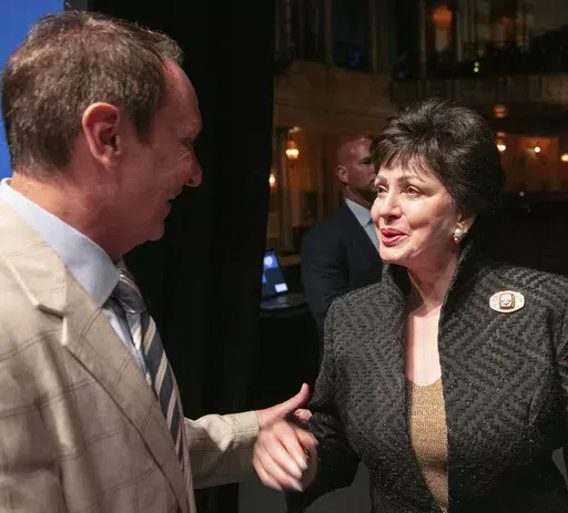 Louisiana Gov. Jeff Landry, left, speaks with New Orleans Saints owner Gayle Benson during a news conference at the Saenger Theater in New Orleans, Tuesday, June 4, 2024, about New Orlean's preparations for hosting NFL football's Super Bowl. (John McCusker/The Times-Picayune/The New Orleans Advocate via AP)