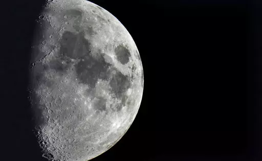 Impact craters cover the surface of the moon, seen from Berlin, Germany, Tuesday, Jan. 11, 2022. The moon is about to get walloped by 3 tons of space junk, a punch that will carve out a crater that could fit several semitractor-trailers. A leftover rocket is expected to smash into the far side of the moon at 5,800 mph (9,300 kph) on Friday, March 4, 2022, away from telescopes’ prying eyes. It may take weeks, even months, to confirm the impact through satellite images. (AP Photo/Michael Sohn, F