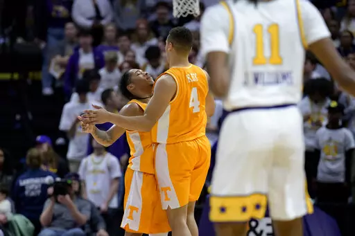Tennessee guard Tyreke Key (4) bumps chests with guard Zakai Zeigler, left, after scoring a 3-point basket against LSU during the first half of an NCAA college basketball game in Baton Rouge, La., Saturday, Jan. 21, 2023. (AP Photo/Matthew Hinton)