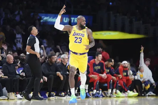 Los Angeles Lakers forward LeBron James celebrates after making a 3-point basket to go over the 50,000 career point mark during the first half of an NBA basketball game against the New Orleans Pelicans, Tuesday, March 4, 2025, in Los Angeles. (AP Photo/Jae C. Hong)