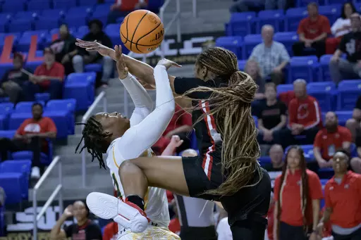 Southeastern Louisiana guard Dijone' Flowers, left, is fouled by Lamar forward NJ Weems, right, during the first half an NCAA college basketball game in the finals of the Southland Conference women's tournament in Lake Charles, La., Thursday, March 9, 2023. (AP Photo/Matthew Hinton)