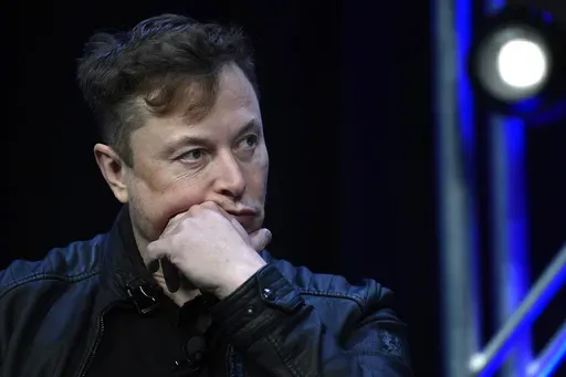 Tesla and SpaceX chief executive officer Elon Musk listens to a question as he speaks at the SATELLITE Conference and Exhibition in Washington, March 9, 2020. (AP Photo/Susan Walsh, File)