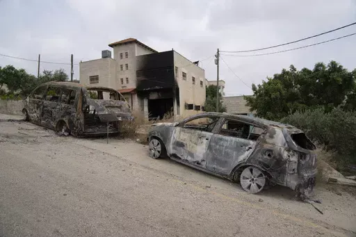 House and vehicles of Ibrahim Dawabsha and his family that were torched during an attack by Israel settlers last month, in the West Bank village of Duma, Tuesday, April 30, 2024. (AP Photo/Nasser Nasser)