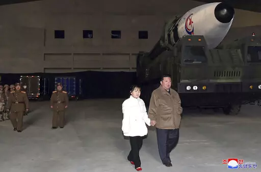 This photo provided on Nov. 19, 2022, by the North Korean government shows North Korean leader Kim Jong Un, right, and his daughter inspecting a missile at Pyongyang International Airport in Pyongyang, North Korea, Friday, Nov. 18, 2022. Independent journalists were not given access to cover the event depicted in this image distributed by the North Korean government. The content of this image is as provided and cannot be independently verified. Korean language watermark on image as provided by s