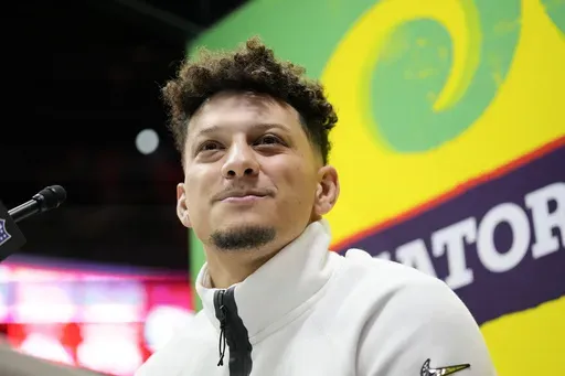 Kansas City Chiefs quarterback Patrick Mahomes (15) participates during Super Bowl 59 Opening Night, Monday, Feb. 3, 2025, in New Orleans, ahead of the NFL football game between the Philadelphia Eagles and the Kansas City Chiefs Sunday. (AP Photo/Brynn Anderson )