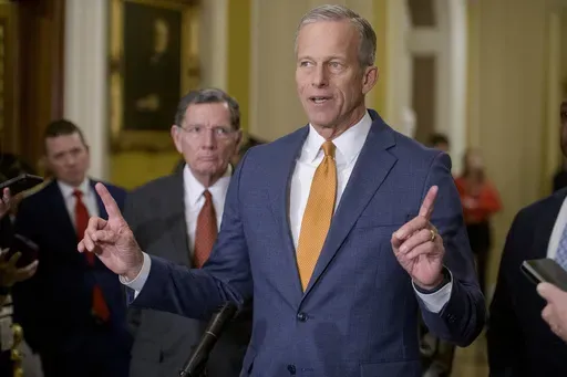 Sen. John Barrasso, R-Wyo., left, listens while Senate Majority Leader John Thune, R-S.D., speaks following the Senate Republican policy luncheon at the Capitol, Tuesday, Feb. 4, 2025, in Washington. (AP Photo/Rod Lamkey, Jr.)
