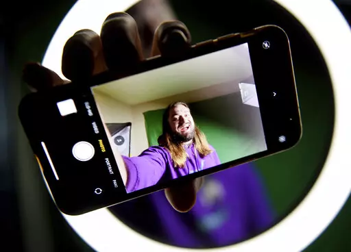Leigh McClendon is photographed on Dec. 9, 2021 making a video on TikTok in Shreveport, La. McClendon, 27, has 2.2 million followers. The norm on that social media app is to pursue your successful niche, and McClendon followed that mantra (Henrietta Wildsmith /The Shreveport Times via AP)