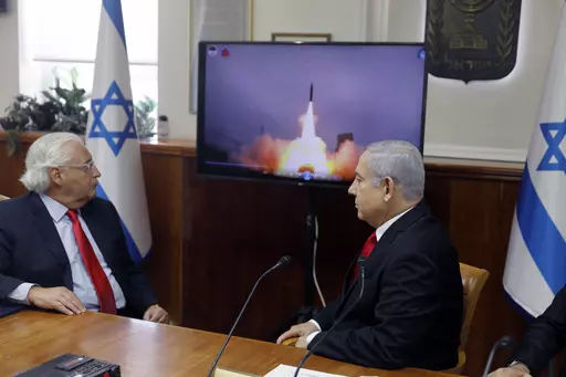 Israeli Prime Minister Benjamin Netanyahu, right, and US Ambassador to Israel David Friedman watch a video which shows the launch of the Arrow 3 hypersonic anti-ballistic missile during a cabinet meeting in Jerusalem on July 28 2019. The United States cleared a weapons agreement between Israel and Germany that marks Israel’s largest-ever defense deal on Thursday Aug. 17, 2023. (Menahem Kahana/Pool via AP, File)