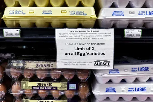 A sign is mounted on a shelve of eggs at a grocery store in Northbrook, Ill., Feb. 28, 2025. (AP Photo/Nam Y. Huh, file)