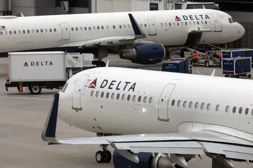 A Delta Air Lines plane leaves the gate on July 12, 2021, at Logan International Airport in Boston. U.S. airline regulators have opened an investigation into Delta Air Lines, which is still struggling to restore operations on Tuesday, July 23, 2024, more than four full days after a faulty software update caused technological havoc worldwide and disrupted global air travel. (AP Photo/Michael Dwyer, File)