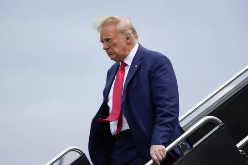 Former President Donald Trump arrives at Ronald Reagan Washington National Airport, Thursday, Aug. 3, 2023, in Arlington, Va., as he heads to Washington to face a judge on federal conspiracy charges alleging Trump conspired to subvert the 2020 election. The Associated Press reported on stories circulating online incorrectly claiming Trump is facing the death penalty on federal charges filed against him in Washington, D.C., on Tuesday related to his efforts to overturn the results of the 2020 ele