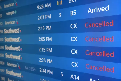 The list of Southwest Airlines flights cancelled grows at Phoenix Sky Harbor International Airport in Phoenix, Dec. 29, 2022. Thousands of air travelers faced flight cancellations and delays this weekend as thunderstorms traveled across the U.S. East Coast and Midwest. (AP Photo/Ross D. Franklin, File)