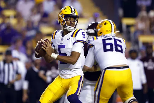 LSU quarterback Jayden Daniels (5) looks for a receiver during the second half of the team's NCAA college football game against Mississippi State in Baton Rouge, La., Saturday, Sept. 17, 2022. LSU won 31-16. (AP Photo/Tyler Kaufman)